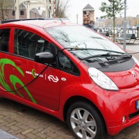 New Greenwheelsl (community car sharing service) Peugeot Ion electric car being charged.