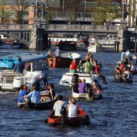 Floating Dutchman Bus surrounded by canal traffic