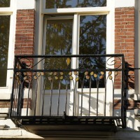Balcony with stained glass accents
