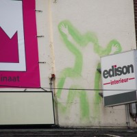 Street art above a store awning