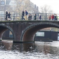 House with spanish tiled roof floating down the Amstel