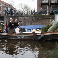 Christmas music blasting, sipping mulled wine. www.kerstboomboot.com