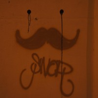 Mustaches make everything better, even a wall.