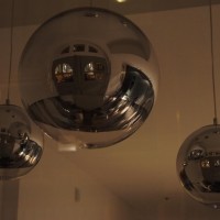 Chrome globes in a neighbours window. Can you see me?