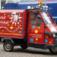 What could possibly be more disturbing than a clown in an Apé Piaggio?