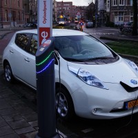 Electric Nissan plugged into a free charging point