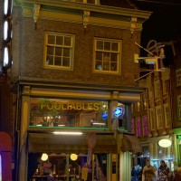 "Balls Sports Bar" is leaning in a dangerous-looking way