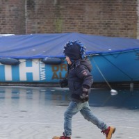 Neighbors skating on the Nieuwe Prinsengracht