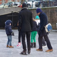 Neighbors skating on the Nieuwe Prinsengracht