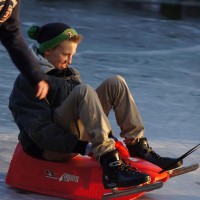 Neighbors skating on the Nieuwe Prinsengracht
