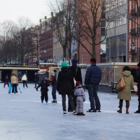 Neighbors skating on the Nieuwe Prinsengracht