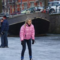 Neighbors skating on the Nieuwe Prinsengracht
