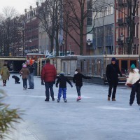 Neighbors skating on the Nieuwe Prinsengracht