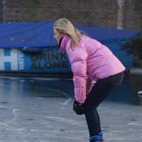 Neighbors skating on the Nieuwe Prinsengracht