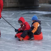 Neighbors skating on the Nieuwe Prinsengracht