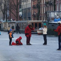 Neighbors skating on the Nieuwe Prinsengracht