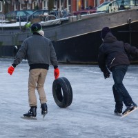 Neighbors skating on the Nieuwe Prinsengracht