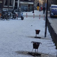 Fire pots outside the Amstelkerk to keep the sledding kids warm.