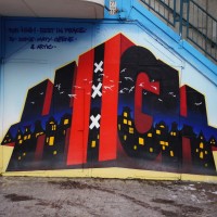 Tribute to a fallen graffiti artist "High" on the wall near the Waterlooplein Hell's Angels support shop.