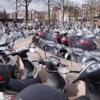 Parking enforcement scooters meeting to talk to AT5, the local TV news show.