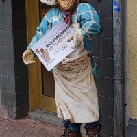 Another extremely creepy thing outside a bakery.