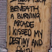 Street poetry, graffiti on a construction site.