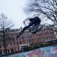 Roller-blader flying out of the skate pool