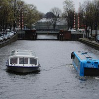 The Floating Dutchman bus passing Hortus Botanical gardens on the Herengracht.