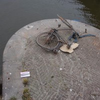 Dead bike on a bridge pylon. Maybe it jumped.