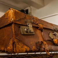 Ancient leather suitcase, now decoration in a restaurant.