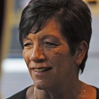 Beautiful woman having a white wine in the Hotel International