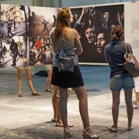 Girls inspecting some World Press Photos