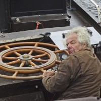 Captain at the helm of a tourboat