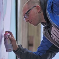 Ben 'EINE" painting a huge wall