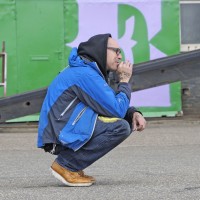 Ben 'EINE" taking a break from painting a huge wall