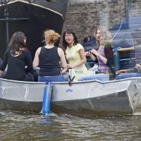 Tourist in a rented electric boat