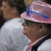 2 sets of blinking LED glasses and a pink sequened hat